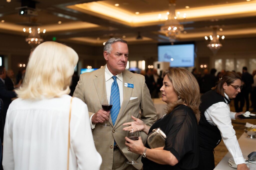 Attendees networking at an Events by Momo corporate event in Houston
