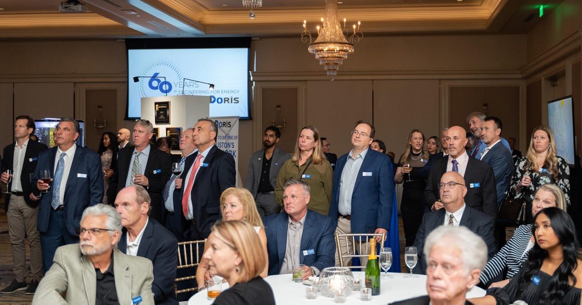 Guests at a corporate anniversary reception in a Houston hotel ballroom